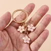 Keychains Lanyards Cute Enamel Keychain Colorful Sakura Flower Key Ring Sweet Key Chains for Women Girls Handbag Accessories DIY Jewelry Gifts d240417