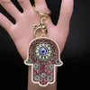 Tornari per la canale ISLAM HAND OF FATIMA Turky Eye Tornario per le mani Hamsa Lucky Eye Hamsa Mano a sospensione Floro Uomini a sospensione Donne Gioielli Chaveiro Para Carro Y240417