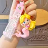 Dessin animé créatif rose fille mignon sirène princesse keychain bœuf aveugle cadeau scolaire sac de carle de trèfle