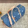 24ss Mens Women Luxurys Designers Denim Bags Outdoor Handbag Inkjet Flower Bag Accessoires Messenger Ladies Travel Handbag Travel outdoors 50cm