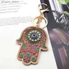 Keychains Lanyards Islam Hand of Fatima Turky Blue Eyes Keychain Lucky Eye Hamsa Hands Flower Keyring Pendant Män Kvinnor smycken Chaveiro Para Carro Y240417