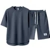 Fritidsportuppsättning för män sommaren trendiga varumärke Löst och enkla korta ärm shorts i kombination med en stilig kläder