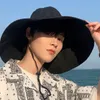 Japon et Corée du Sud Big Brim Hat Womens printemps et été pliable voyage de voyage de soleil chapeau de soleil couleurs de couleur décontractée chapeau pêcheur 240415
