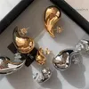 Fransk guldfärg glansig vatten droppe kommasörhängen för kvinnor nisch high end cold och lätt lyxig högkvalitativ charm smycken