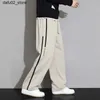 Men's Pants 2024 New Sports Pants Mens Pocket Jogger Wide Leg Jogging Pants Neutral Breathable Loose Outdoor Sports Pants Fashion Design Jogging Pants Q240417