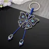 Keychains Lonyards Crystal Blue Evil Eye Perle Butterfly Animal Keychain Keyring Femmes Tassel Tassel Lucky Eye Insect Sac voiture Clé Accessoire Bijoux Y240417