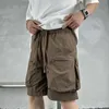 Stora fickbeklädda shorts för män sommar andas snabbt torkande capris streetwear fast färglast korta byxor 240412