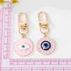 Keychains Lanyards 1 Round Evil Eye Keychain Ami Cavyring Bohemian Blue Eye Sac voiture AirPods Boîte clé Téléphone Charme Accessoire Jewelry Y240417