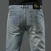 Designer de jeans masculin en jean en jean pour hommes haut de gamme de la mode de mode à petite marque double pantalon jeunesse