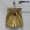 Women's Two Piece Pants Designer 2024 Spring/Summer New Fashion Casual Panel Leather Design Open Back Coat+Flower Bract Waist Shorts Set DYMR