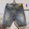 Menina de moda Hole casual shorts jeans koreon streetwear roupas machos de homem verão solto azul jorts 240417