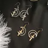 2024 Boucles d'oreilles Stud Design Simple Punk Geometric Hollow Moon Cross for Women Metal Tassel Fashion Bijoux Brincos Cross de boucle d'oreille en gros