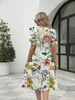 2024 Europejskie i amerykańskie lato Nowe damskie moda luźna kwiat nadruk okrągły szyjka krótkie rękawowe sukienka kieszonkowa 240415