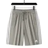 Лето мужские эластичные шелковые шорты негабаритные и увеличенные спортивные спортивные тренды пляжных брюк Capris