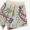 Rhude Cashew Colored Knitted Jacquard Drawstring Shorts American High Street 캐주얼 해변 바지 남성