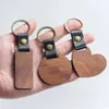 Tornari percorsi in legno PU Leather Keychain per uomini Donne Torchia a sospensione rotonda a forma di cuore per le chiavi Accessori per gioielli D240417