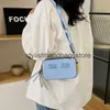 Schoudertassen stoffen zakken handtassen nieuwe trend gepersonaliseerde massieve kleurcamera tas modieuze en eenvoudige handheld crossbody H240417