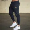 Męskie spodnie 2024 Męskie spodnie do joggingu Summer wciągające spodnie sportowe cienkie spodnie sportowe sporne spodnie sportowe Casual Street Clothing Q240417