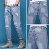 Jeans de los jeans para hombres Pantalones del agujero roto Tubo de algodón sólido delgada Tubo recto