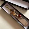 Cherry Charm Keychain سلسلة المفاتيح الفاخرة جميلة صغيرة صغيرة الكرز حلقة مفتاح للنساء حامل حقيبة سحر الزخرفة الملحقات 2021 سلاسل 8R1G