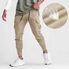 Pantalon masculin Solide Solid Fitness Running Pockets Long Plant Sport Sport Jogger pantalon pour les hommes Breathable