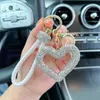 Keychains Lanyards Creative Hollow out Ceramic Clay Full Diamond Love Key Chain Leather Rope Sticking Water Diamond Car Key Pendant Simple d240417