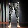 Q0x0 Men's Jeans Fashion Designer Men Camouflage Camouflage pantalon multiples pantalons de fret décontractés Hombre Zipper Bottom Hip Hop Joggers D240417