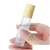 Rouler sur des bouteilles en gros de 5 ml 10 ml Bouteille en verre transparente en verre à grain de bois Capure en plastique pour l'huile essentielle par chute cosmétique D Dhv5b