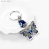 Klasyna Smycze Lucky Eye Alloy Butterfly Glass Glass Turkish Eye Eye Bead Bagbajna torba do łańcucha biżuterii LLAVERO Porte Cl Y240417