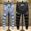 Jeans maschile primavera autunno nuovo denim maschile elastico studenti sciolti adolescenti cowboy streetwear gamba harem pantaloni da pista da pista da pista d240417