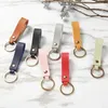 Nyckelringar Lanyards 8 Färger Fashion Pu Leather Keychain Business Gift Leather Key Chain Men Women Car Key Strap midjeplånbok Keychains Keyrings D240417