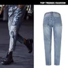 Jeans femminili sciolte pantaloni ritagli di denim a gamba dritta sequenziamento ricamato metallico lavato per buchi in difficoltà