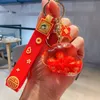 New product full of blessings, with auspicious characters in oil, flowing sand, drifting bottles, keychains, creative and festive New Year keychains, wholesale