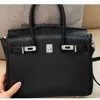 Femmes Luxury Hands sac à main Logo Sac en cuir en cuir Lycoue Grain Top Top Couche CowHide Silver Handbag Advanced Feeling One épaule Bag Messenger Womens Womens