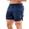 Shorts masculinos secos rápidos fitness de seca rápida com bolsos carta de streetwear impressão na cintura elástica do meio do rise para academia