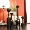 Kerzenhalter minimalistischer Stil schwarzer Holzhalter kreativer Kunst Ornamente Sitz
