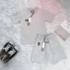 Projektanci marka dressów męskie Dwuczęściowe zestawy sportowe litera z krótkim rękawem fioletowa koszula sportowa odzież Pure Cotton Jogger garnitur swobodny dres y2k