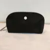 Ll sac cosmétique portable forme de coque portable de voyage de voyage sac à main