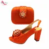 サンダルオレンジ色の特別なデザインイタリアンセクシーな女性の靴とバッグプラットフォームとマッチするガーデンパーティー用の快適なかかとポンプ