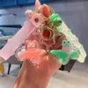 Nouveau produit créatif mignon Huile de grenouille de chien en liquide bouteille à dérive porte-clés femelle femelle mignon carton de dessin animé
