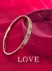 Высококачественный романтический дизайн мужчина и женщина для браслета онлайн -продажа алмазной браслет карты Love Fomens с закрытым песком Сплошное золото с хорошим браслетом