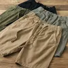 Shorts maschile uomini estate a colori solidi patch tasca coglione elastico mezzo pantaloni casual sciolti sciolti pantaloni sportivi