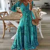 Grundläggande avslappnade klänningar europeiska och amerikanska ny bohemisk stil ny 3/4 hylsa lång klänning hög midja V-ringad tryckt fragmenterad blommaklänning för kvinnor