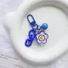 Keechchains carino piccolo animale keychain a sospensione creativa con cuffia studentesca a campana a campana di caramella