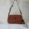 Designer de bolsa, vendendo 50% de bolsas de ombro novas cores sólidas com cor da moda velha flor curva estampa pendurada saco de axilia virar um ombro feminino