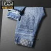 Designer de jeans masculin printemps 23 Nouveau pantalon de mode coréen élastique à tube droit pour les jeunes