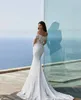 2024 Moderne Off the Schulter Meerjungfrau Brautkleider Langarm Spitze appliziert Strand Boho Bridaltrain Vestidos YD