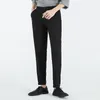 Pantalon masculin mode haut de gamme coréen décontracté raide raccroped bouton solide bouton zipper pochelle tendance pantalon simple lâche