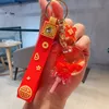 New product full of blessings, with auspicious characters in oil, flowing sand, drifting bottles, keychains, creative and festive New Year keychains, wholesale