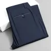 Pantaloni cortosi da uomo allungare il solido set di asciugatura per ufficio casual nero smart cimopere estate gamba dritta coreana